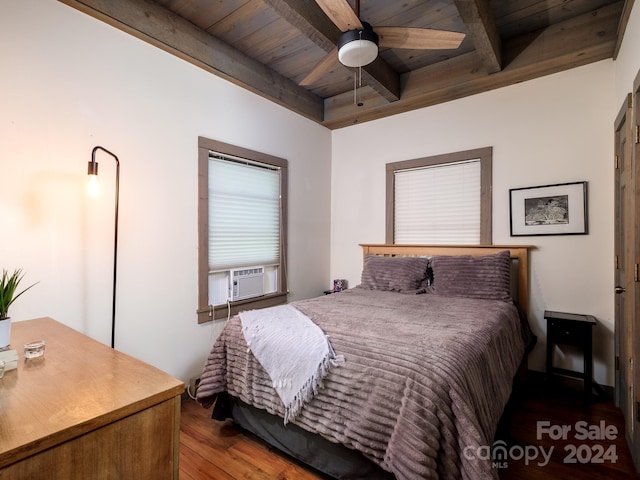 bedroom with ceiling fan, beamed ceiling, hardwood / wood-style floors, cooling unit, and wood ceiling