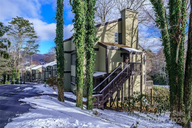 view of snow covered property