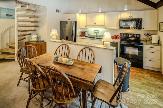 300 Glenwood Ln Unit K-38, Sugar Mountain, NC 28604 - dining room featuring stairway and light wood-style floors