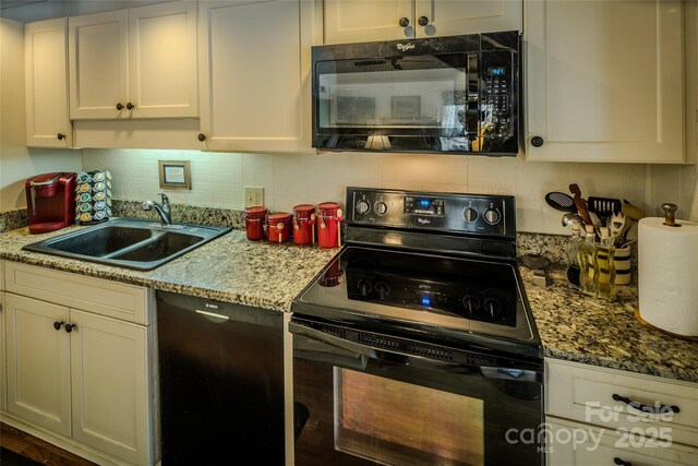 300 Glenwood Ln Unit K-38, Sugar Mountain, NC 28604 - kitchen with black appliances, decorative backsplash, white cabinetry, and light stone counters