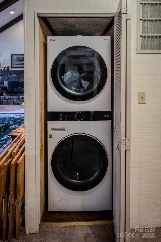 300 Glenwood Ln Unit K-38, Sugar Mountain, NC 28604 - washroom with stacked washer and clothes dryer and carpet