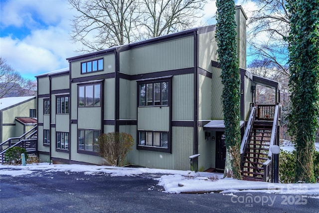 300 Glenwood Ln Unit K-38, Sugar Mountain, NC 28604 - snow covered property with stairway