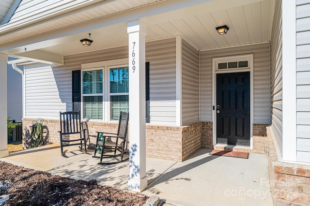 doorway to property with a porch