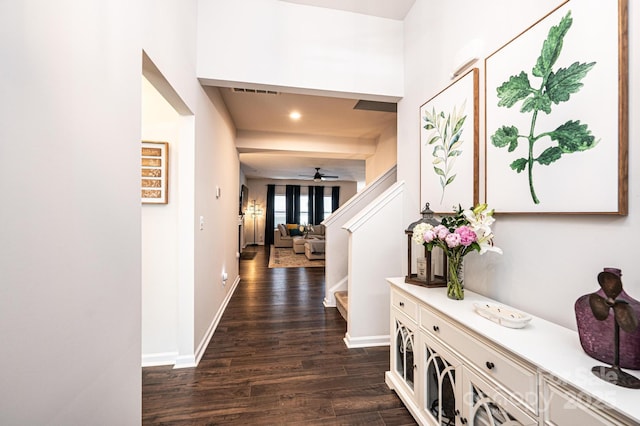 hall featuring visible vents, baseboards, dark wood-style floors, stairs, and recessed lighting