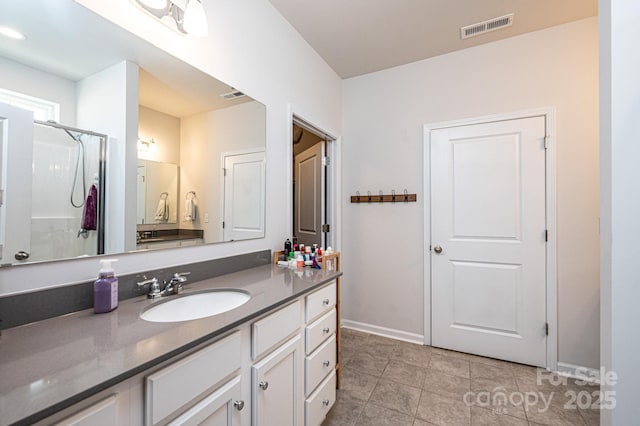 full bathroom with tile patterned floors, baseboards, visible vents, and vanity