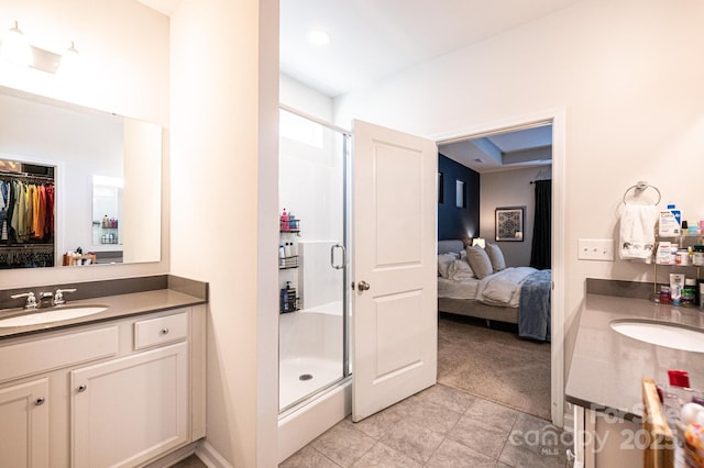 ensuite bathroom with ensuite bath, vanity, and a shower stall