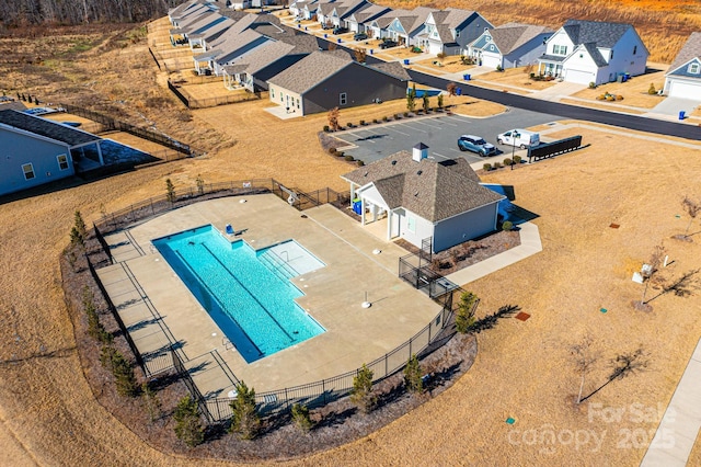 birds eye view of property with a residential view