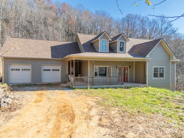 view of front of house with covered porch and a garage