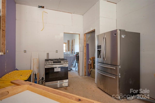 kitchen featuring concrete floors and stainless steel appliances