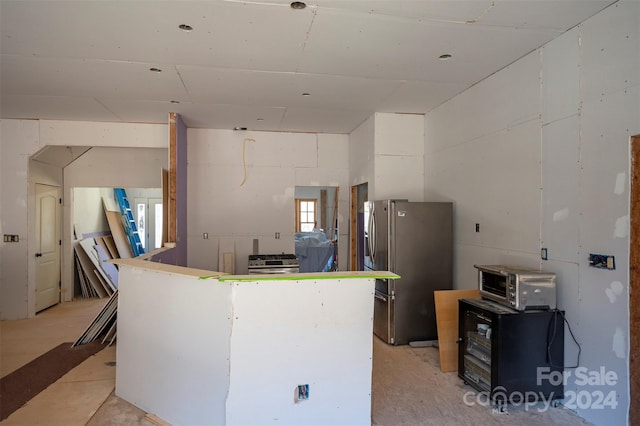 kitchen featuring stainless steel refrigerator