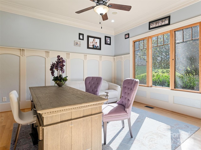 office space featuring ceiling fan, light hardwood / wood-style floors, and ornamental molding