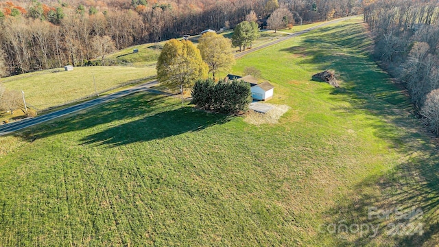 birds eye view of property featuring a rural view