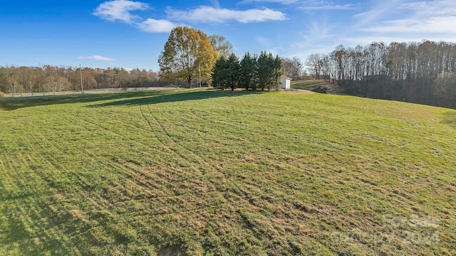 view of yard with a rural view