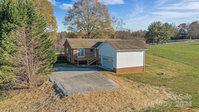 view of outbuilding with a garage and a yard