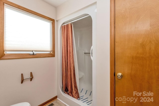 bathroom with a shower with shower curtain