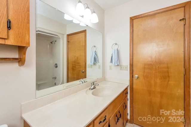 bathroom with vanity and shower / washtub combination