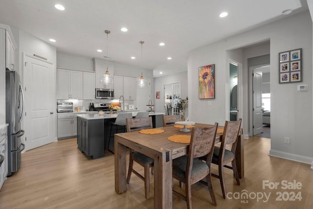 dining room featuring light hardwood / wood-style flooring