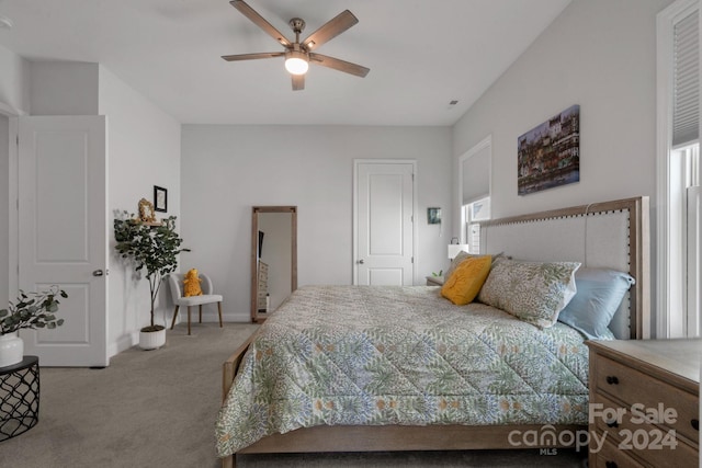 bedroom with ceiling fan and light colored carpet