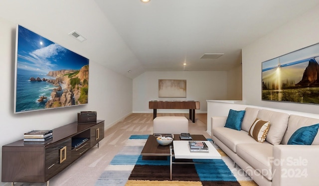 carpeted living room with vaulted ceiling