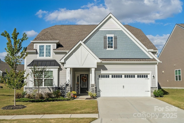 craftsman inspired home with a garage and a front lawn