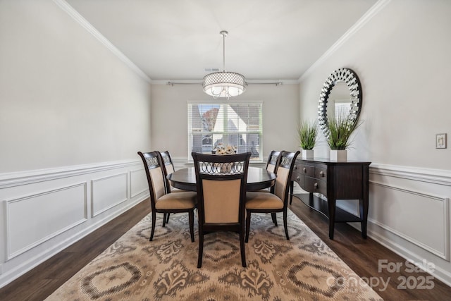 dining room featuring dark hardwood / wood-style flooring and crown molding