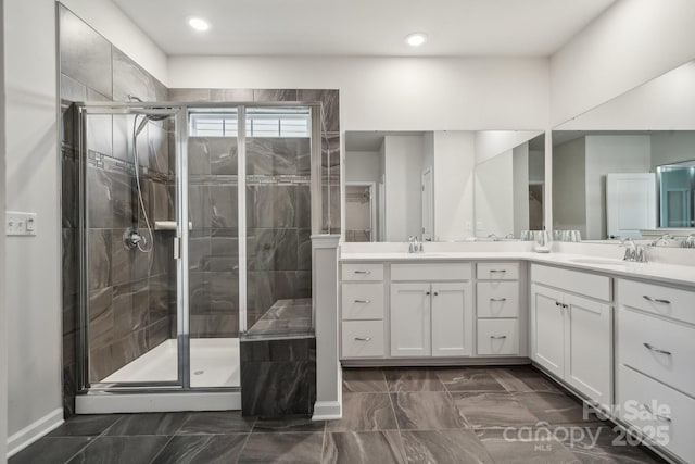 bathroom featuring vanity and an enclosed shower