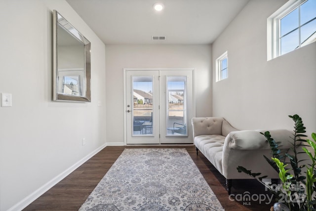 entryway with dark hardwood / wood-style flooring