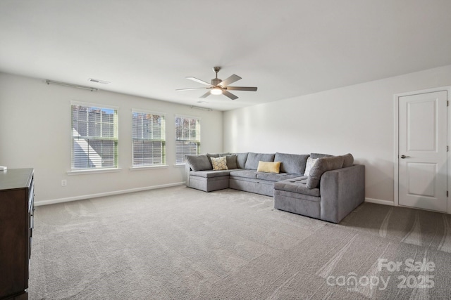 carpeted living room featuring ceiling fan