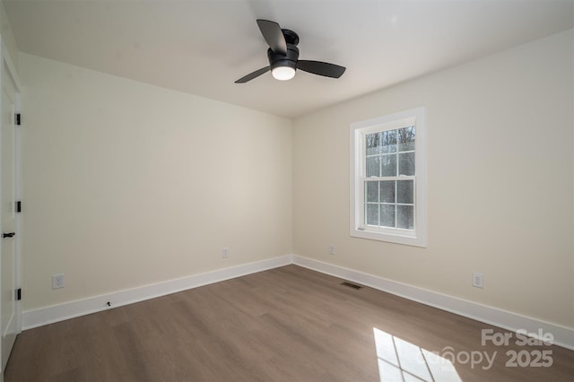 unfurnished room with hardwood / wood-style flooring and ceiling fan