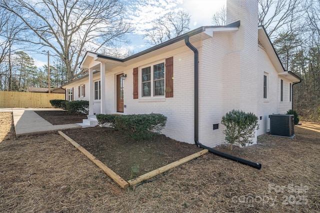 ranch-style home featuring central AC