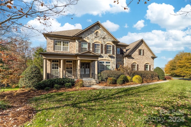 view of front of home with a front lawn and covered porch