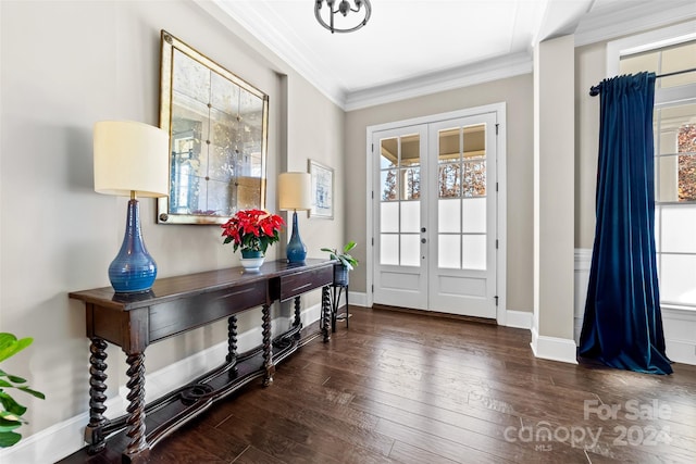 foyer with french doors, dark hardwood / wood-style flooring, and ornamental molding