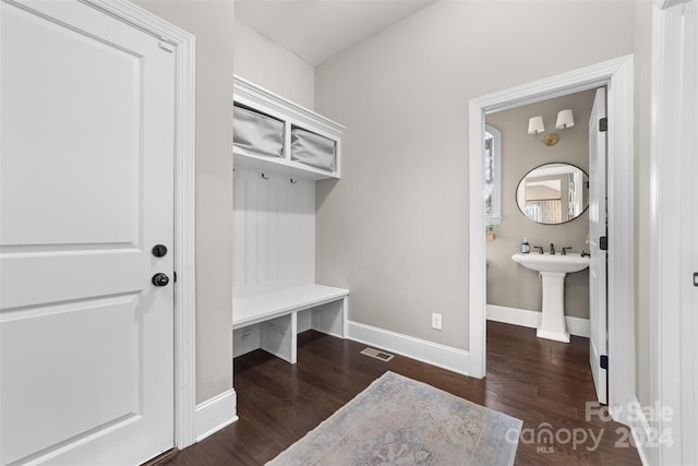 mudroom with dark hardwood / wood-style flooring