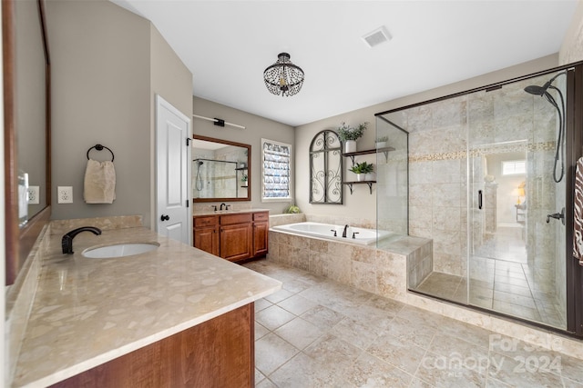 bathroom featuring separate shower and tub, tile patterned flooring, and vanity