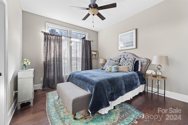 bedroom featuring ceiling fan and dark hardwood / wood-style floors