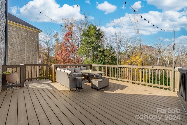 wooden terrace featuring an outdoor hangout area