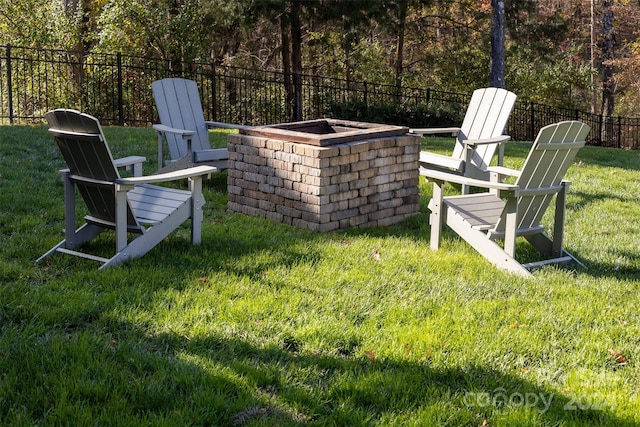 view of yard with an outdoor fire pit