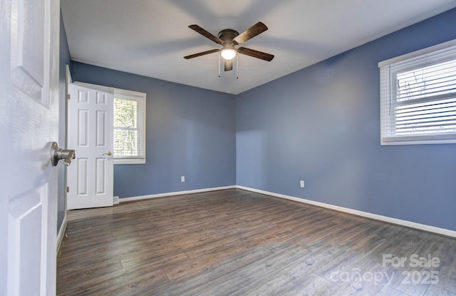 unfurnished room with ceiling fan and dark hardwood / wood-style flooring