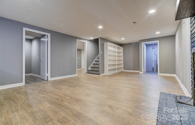 basement featuring light hardwood / wood-style flooring