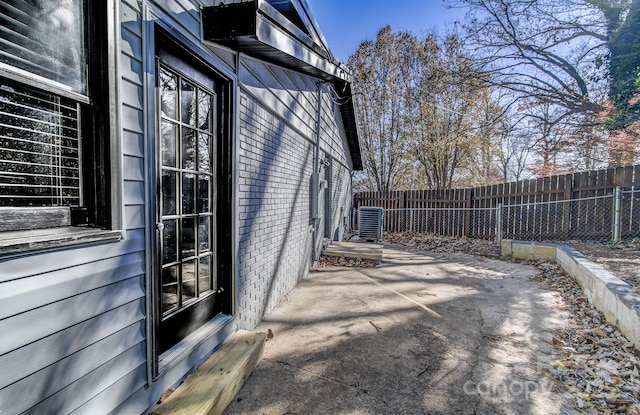 view of side of home with a patio area