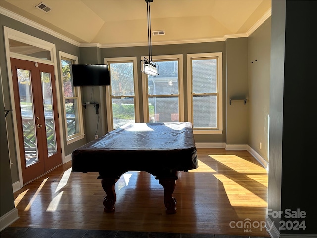 game room with a tray ceiling, crown molding, hardwood / wood-style floors, and billiards