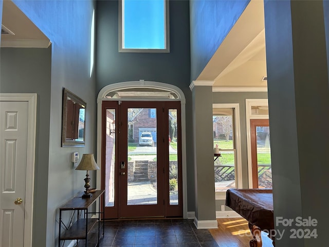 entryway featuring dark hardwood / wood-style flooring, crown molding, and billiards