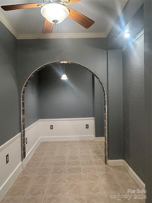 1327 Moonshadow Ln, Shelby, NC 28150 - empty room featuring ceiling fan, crown molding, and a wainscoted wall