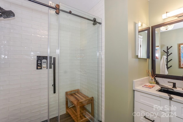 bathroom with vanity and an enclosed shower