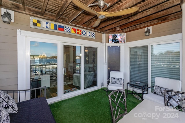 view of patio / terrace featuring ceiling fan