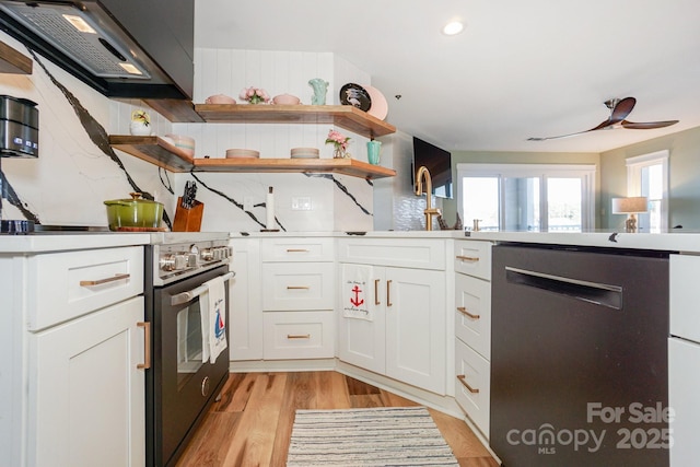 kitchen with decorative backsplash, open shelves, light wood-type flooring, high end stainless steel range, and dishwashing machine