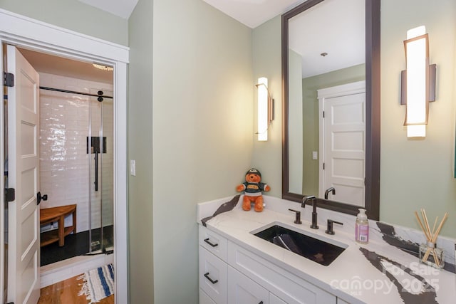 full bathroom with vanity and a stall shower