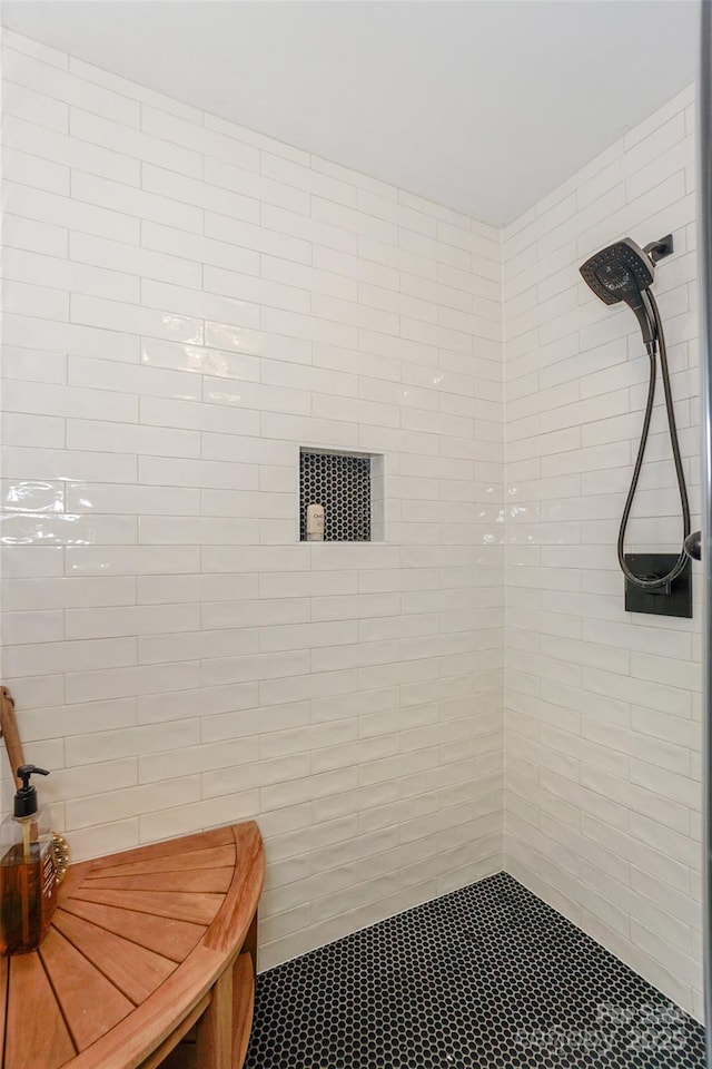 bathroom with a tile shower