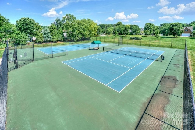 view of sport court with fence
