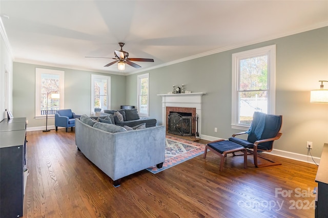 living room with a fireplace, hardwood / wood-style flooring, ceiling fan, and ornamental molding